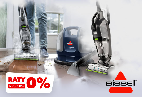 Dwa odkurzacze marki Bissell oraz urządzenie do czyszczenia dywanów, umieszczone na podłodze z drewnianymi panelami. W lewym dolnym rogu znajduje się napis: Raty 0% RRSO 0%.