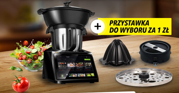 Czarny robot kuchenny z wyświetlaczem, obok którego leży miska sałatki oraz pomidor. Po prawej stronie widoczne są trzy różne przystawki, a nad nimi znajduje się żółty napis: Przystawka do wyboru za 1 zł.
