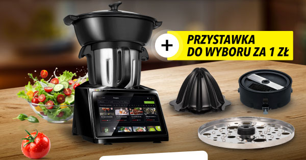 Czarny robot kuchenny z wyświetlaczem, obok którego leży miska sałatki oraz pomidor. Po prawej stronie widoczne są trzy różne przystawki, a nad nimi znajduje się żółty napis: Przystawka do wyboru za 1 zł.